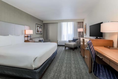 Recharge in a quiet room with lounge seating and HDTV.