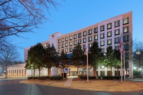 Pull up and unwind at our modern hotel entrance.