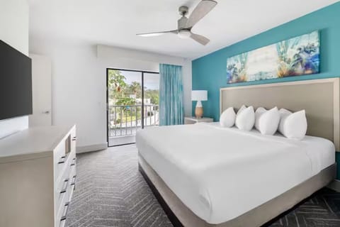 Sink into crisp linens and wake up to balcony views.