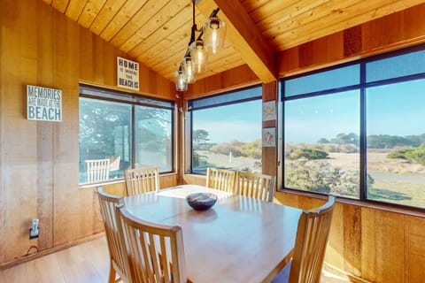 Dine with a view! The dining area features large windows that frame the picturesque landscape, creating a memorable setting for family meals.