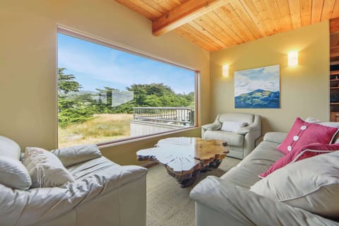 Morning light fills this second living area, providing the perfect spot to relax with a book or catch up with loved ones.
