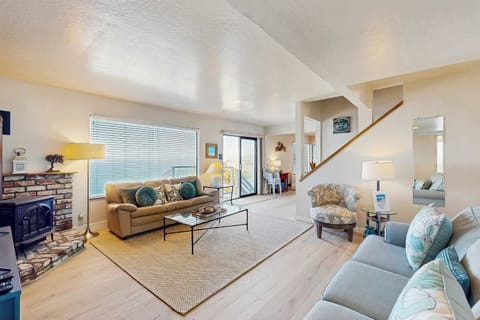 The living room opens right to the deck -- settle into the sofa by the gas fireplace and let the ocean set the pace for your stay.