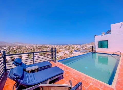 Shared pool terrace w/ loungers & clear blue water for laid-back afternoons