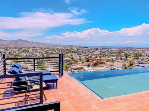 Shared Infinity-edge pool overlooking the city, perfect for soaking in sweeping views