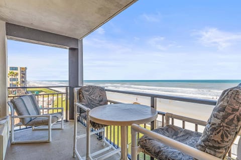 Relax on this oceanfront balcony beach stay, featuring sweeping shoreline views, fresh sea breeze, and comfortable seating—perfect for morning coffee or sunset unwinding by the waves.