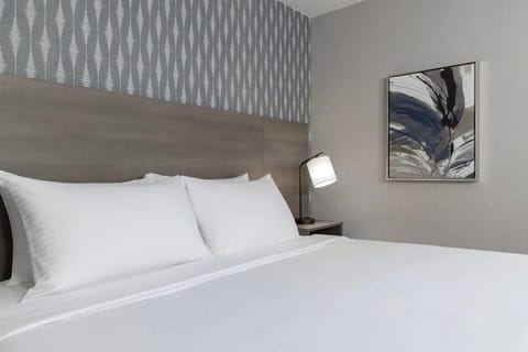 Sink into plush bedding for a deeply restful night.