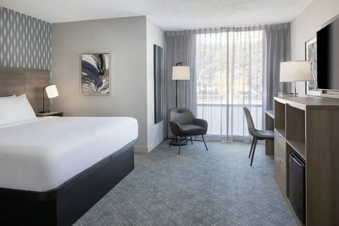 Unwind in a bright, spacious room with cozy seating.