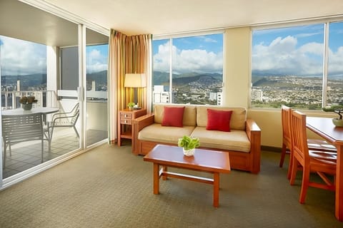 Unwind on the sofa while sunlight pours through picture windows