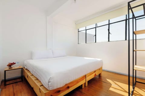 Bedroom with king-size bed and natural light