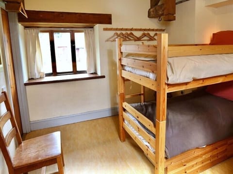 A spacious 2-bedroom room with a bunk bed, perfect for a comfortable self-catering stay.