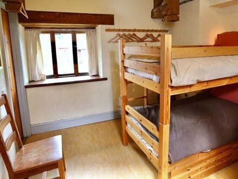 A spacious 2-bedroom room with a bunk bed, perfect for a comfortable self-catering stay.