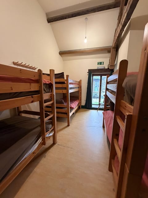 Garden access for a 6-bed room with bunk beds, perfect for group stays at Wern Watkin Bunkhouse