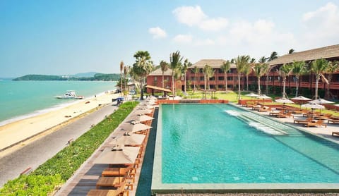 Soak up sunshine beside the beachfront pool and loungers.