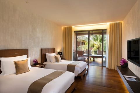 Settle into spacious comfort with terrace views and quiet elegance.