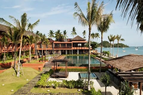 Escape to a beachfront pool oasis with sweeping sea views.