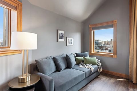Lounge comfortably by the window with soft cushions and views.