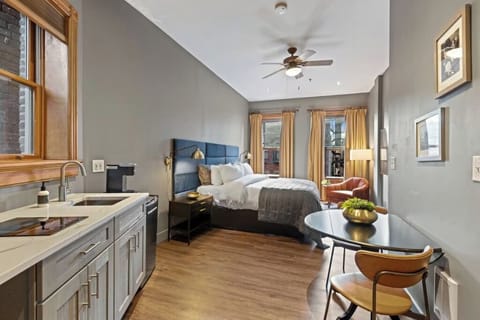 Unwind in a stylish studio with kitchenette and plush bed.