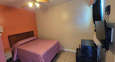 Recharge in a simple room with TV and mini fridge