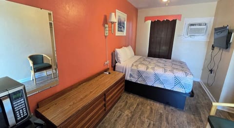 Settle into a cozy room with dresser space and TV
