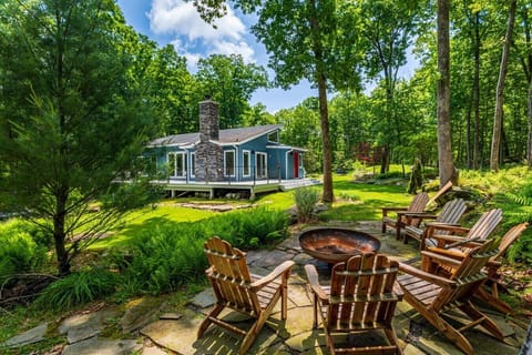 Gather around the fire pit and soak in the peaceful beauty of the surrounding forest - your perfect Catskills retreat