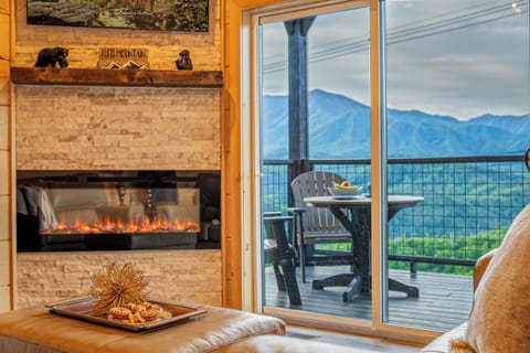 Panoramic Smoky Mountain views right from the living room enjoying the fireplace