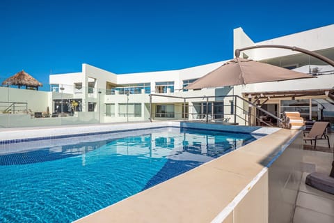 Enjoy your private rooftop oasis with a sparkling pool and spacious sun deck. Relax in shaded seating or lounge in the sun.