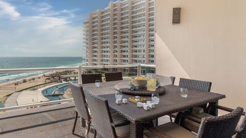 Large outdoor dining table offers convenience on the balcony.