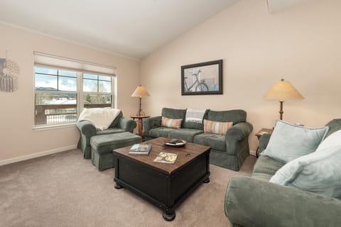 Sink into plush seating where soft throws and warm lighting create your perfect retreat for evening conversations or quiet reading.
