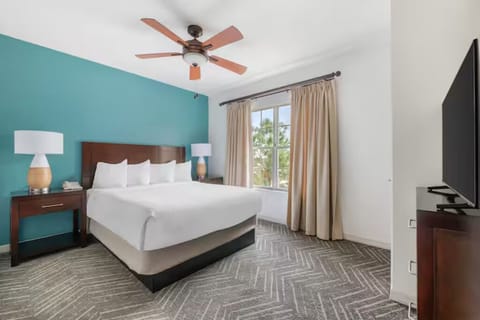 Stretch out with extra space, soft carpet, and in-room TV.