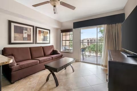 Unwind on the sofa, sliding doors open to balcony breezes.