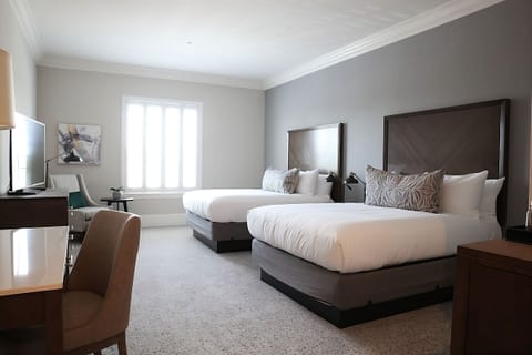 Settle into crisp linens on comfortable double-queen beds.