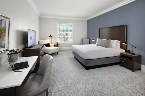 Unwind in a spacious king room with dedicated work desk.