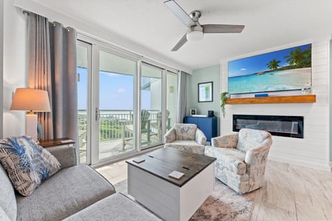 Comfy living room with great ocean view, electric fireplace and 65" TV.