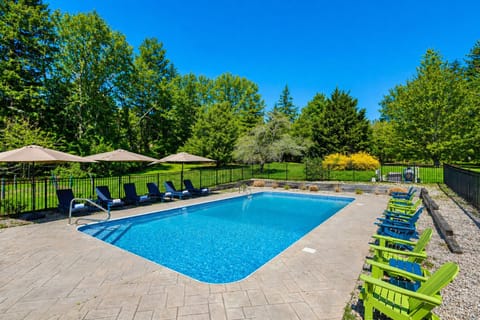 Heated pool with lounge chairs—perfect for relaxing Cape Cod days.