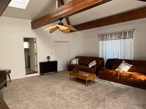 Spacious Living room with vaulted ceilings and reclining couches