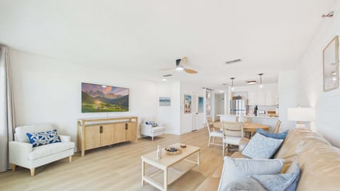 Open concept living area with comfortable furnishings and sleeper sofa + balcony access (sleeps 2)