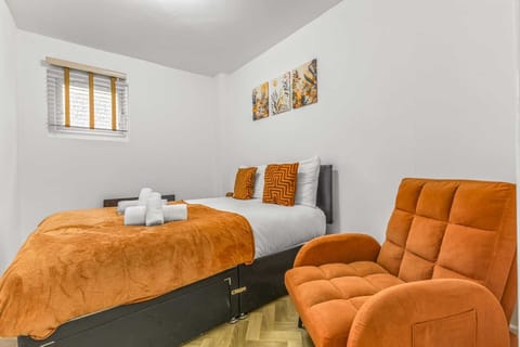 Charming Bedroom: Bright hues and plush decor invite relaxation after your adventures!