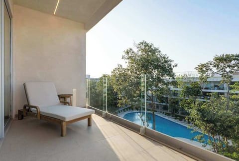 Private balcony with pool and garden views