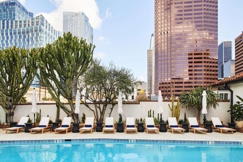 Dive into sunshine with skyline views and plush loungers.