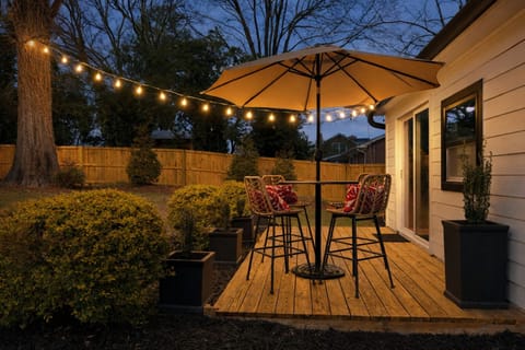 Fenced yard, deck, café seating, lights. Quiet, pet-friendly retreat.