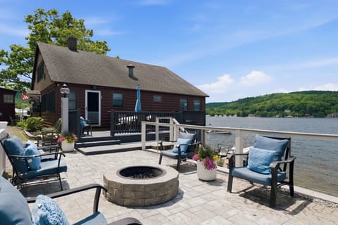 Enjoy a spacious lakefront setting with the main house anchored along the shoreline.