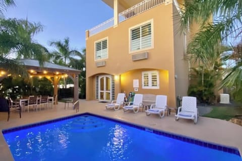 Backyard Pool and Gazebo with Chairs