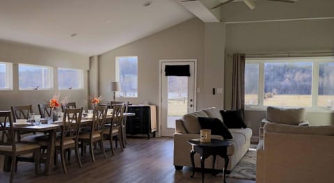 Gather, connect, and unwind in this light-filled living and dining space overlooking open countryside. Share meals, meaningful conversation, and quiet moments as natural light pours in and the pace of life gently slows around you.
