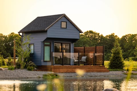 Cabin exterior front pond golden hour