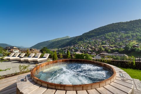 Outdoor hot tub. Available upon request at additional fee. 