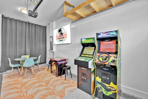 Game Room - Fast & Furious, Golden Tee Golf, Big Buck Hunter, NBA Jam, Ms. Pacman, 65in TV, futon, card table