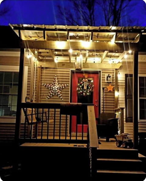 Front covered porch with swing.