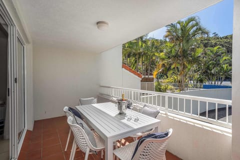 7 piece white outdoor dining setting with weather resistant outdoor pillows for added comfort