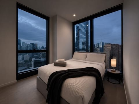 Sleep amidst corner views of the city skyline in the master bedroom.