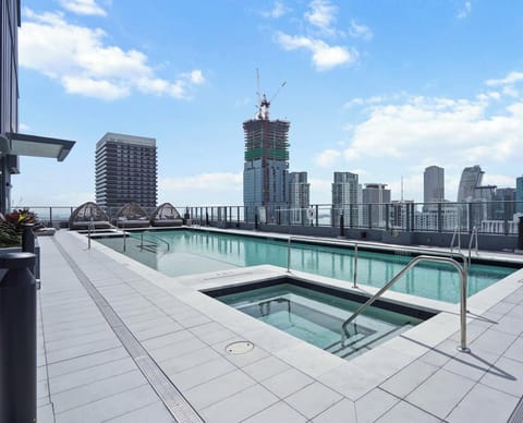 Cool off in the rooftop pool, the perfect spot to enjoy the surrounding skyline.